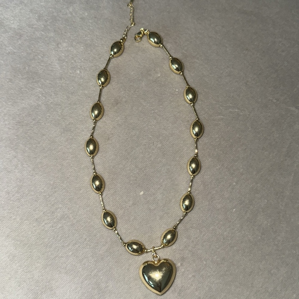 Puffy heart gold necklace of the summer !